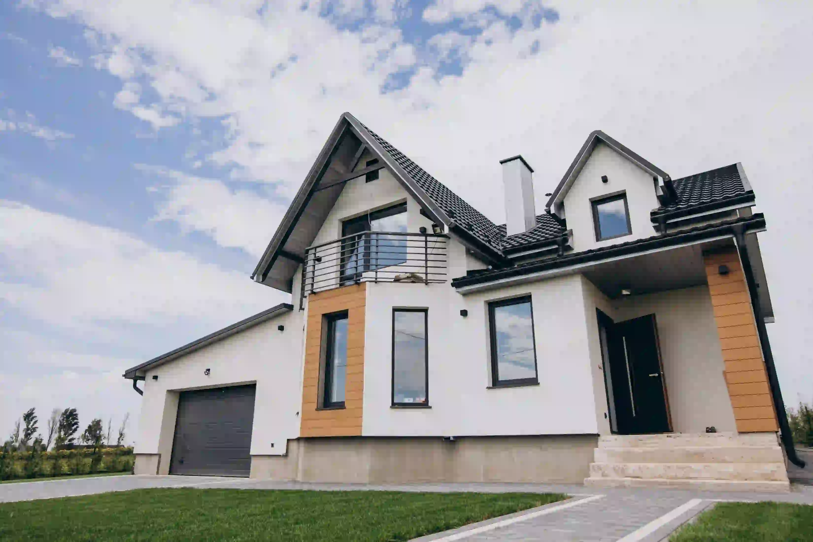 Modern home exterior illustrating how to write a real estate market report for clients.