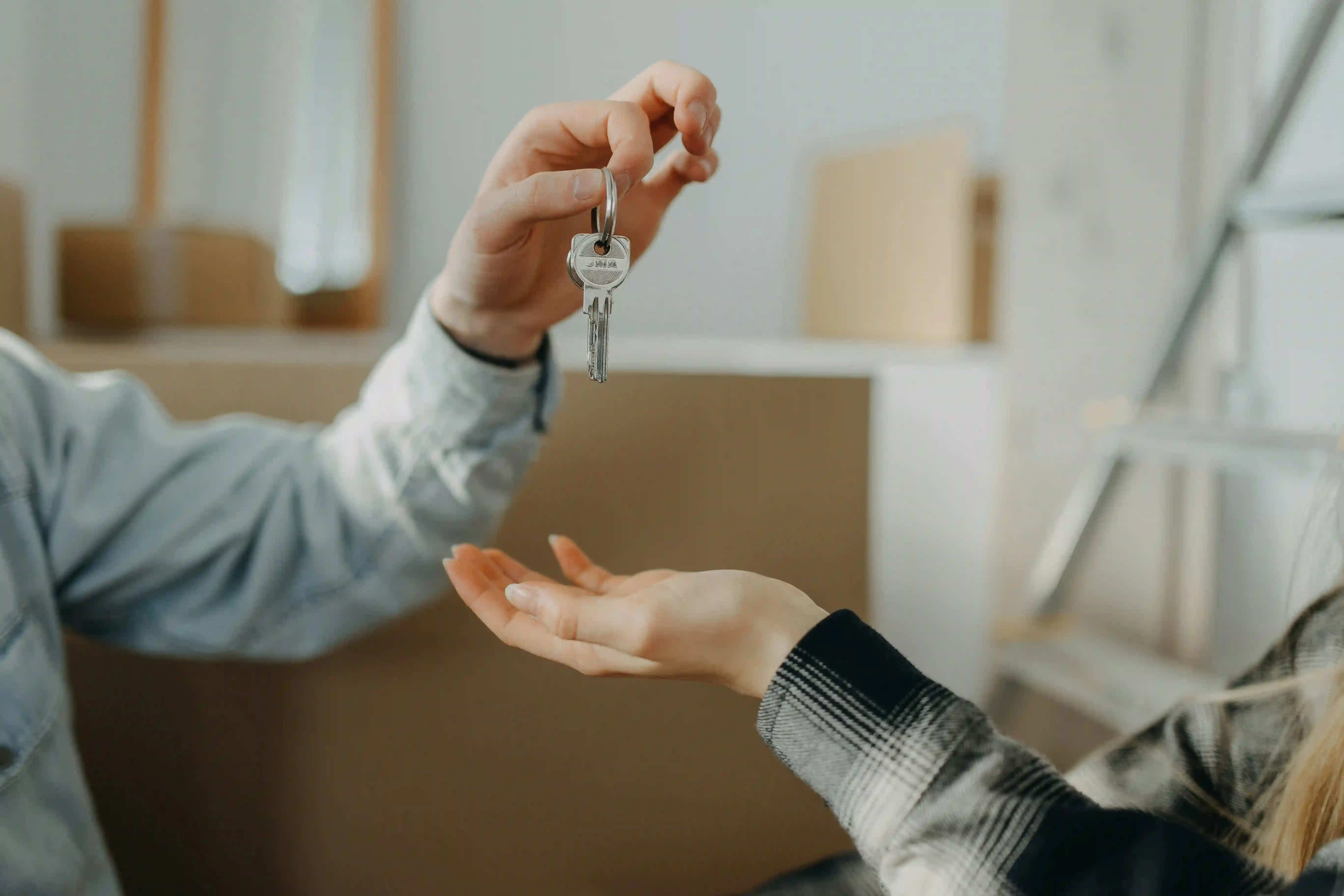 Real estate key handover showing how to attract real estate clients with organic content.