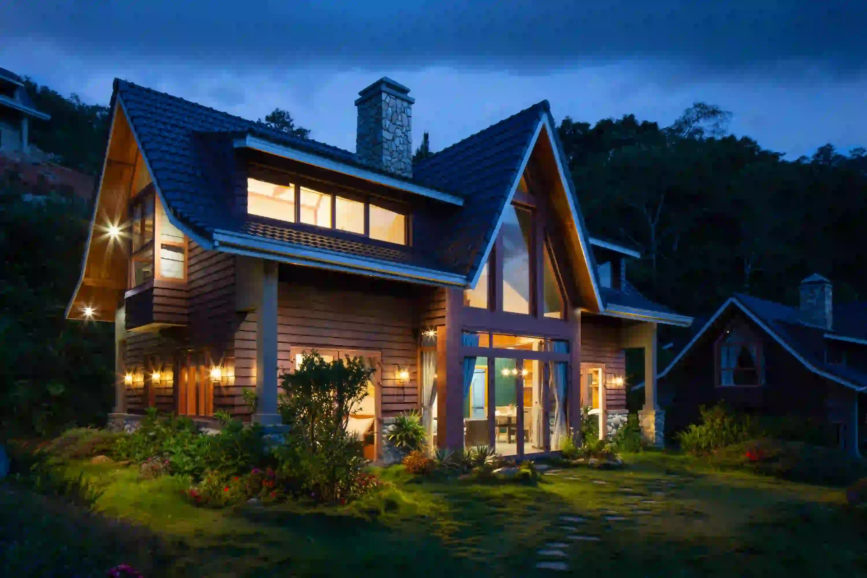 Luxury mountain home at dusk showcasing how to get real estate leads from video content.