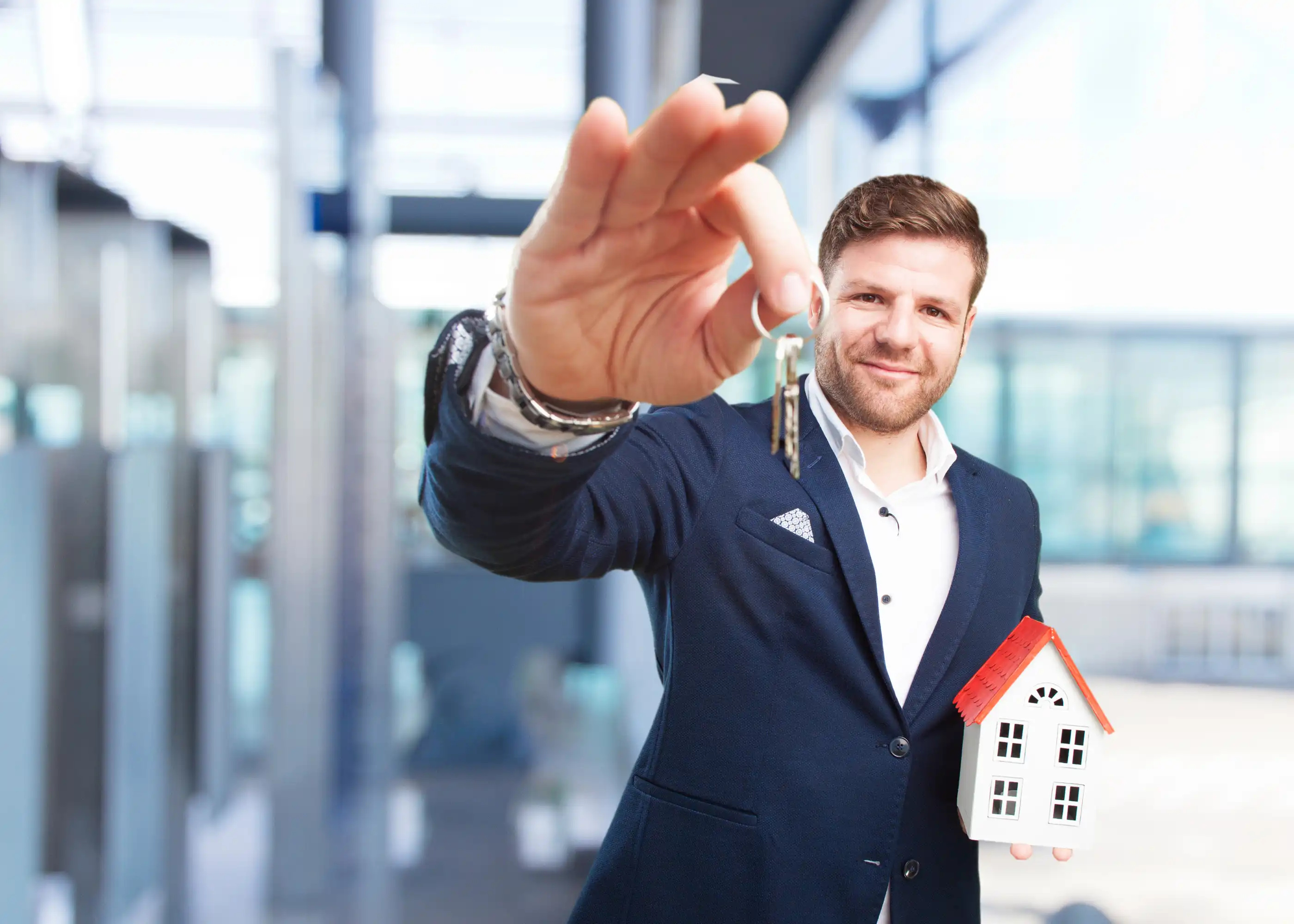 Real estate agent IDX website lead generation tips with agent holding house keys