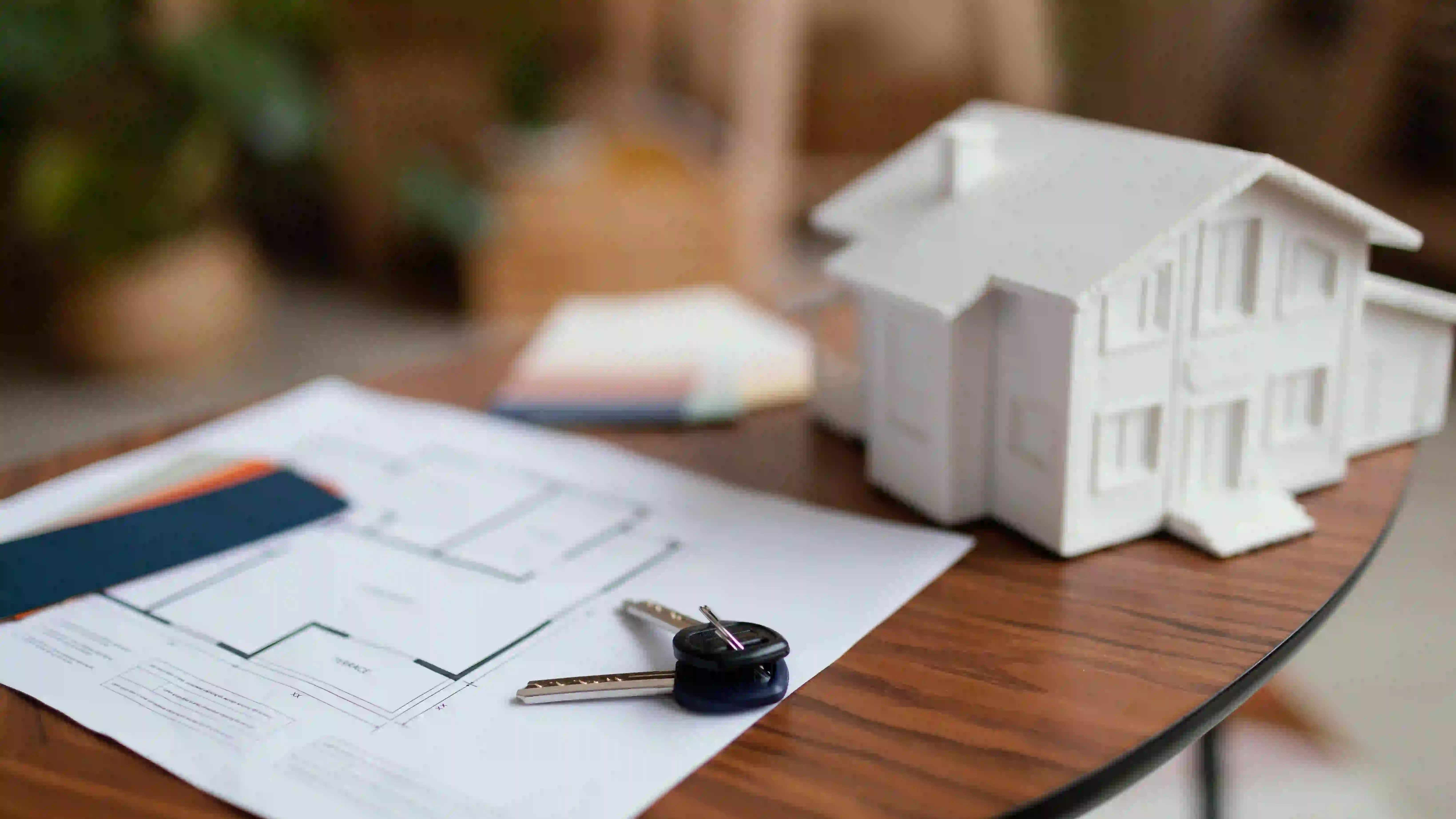 Real estate agent first time buyer content ideas featuring house keys and floor plans.
