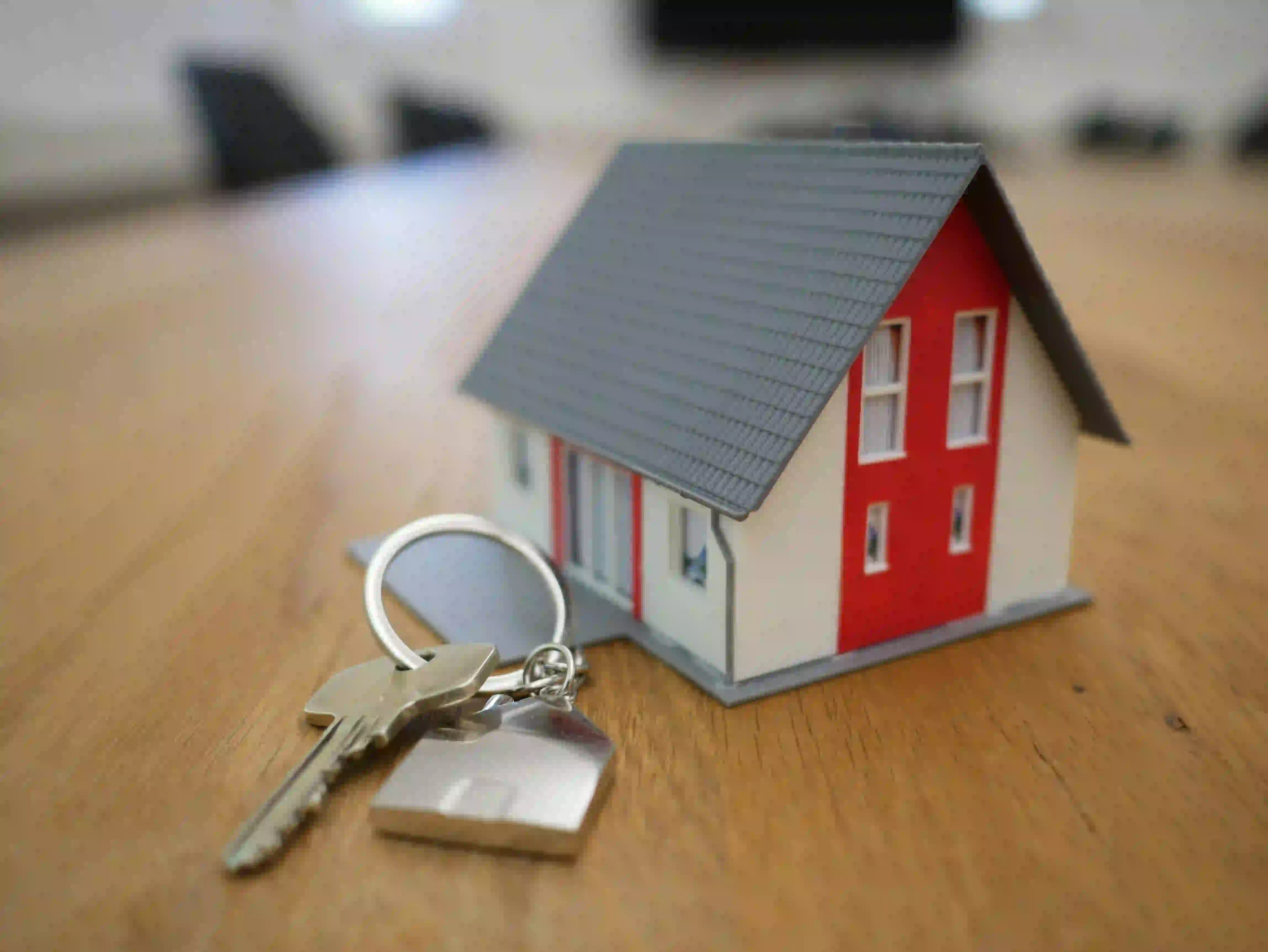 Miniature house and keys representing a real estate agent lead nurturing strategy.