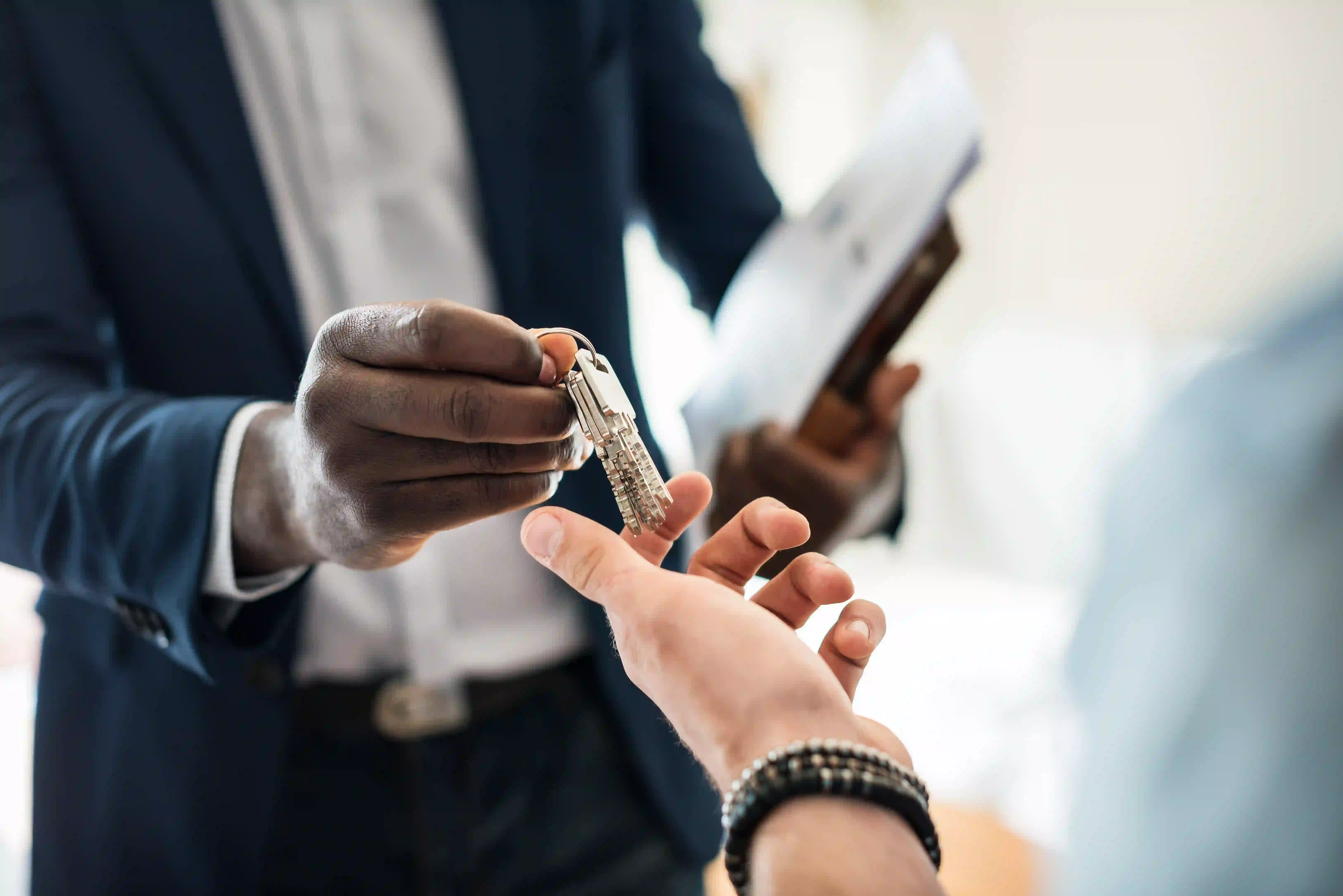 Real estate listing launch strategy for agents featuring a client key handover.