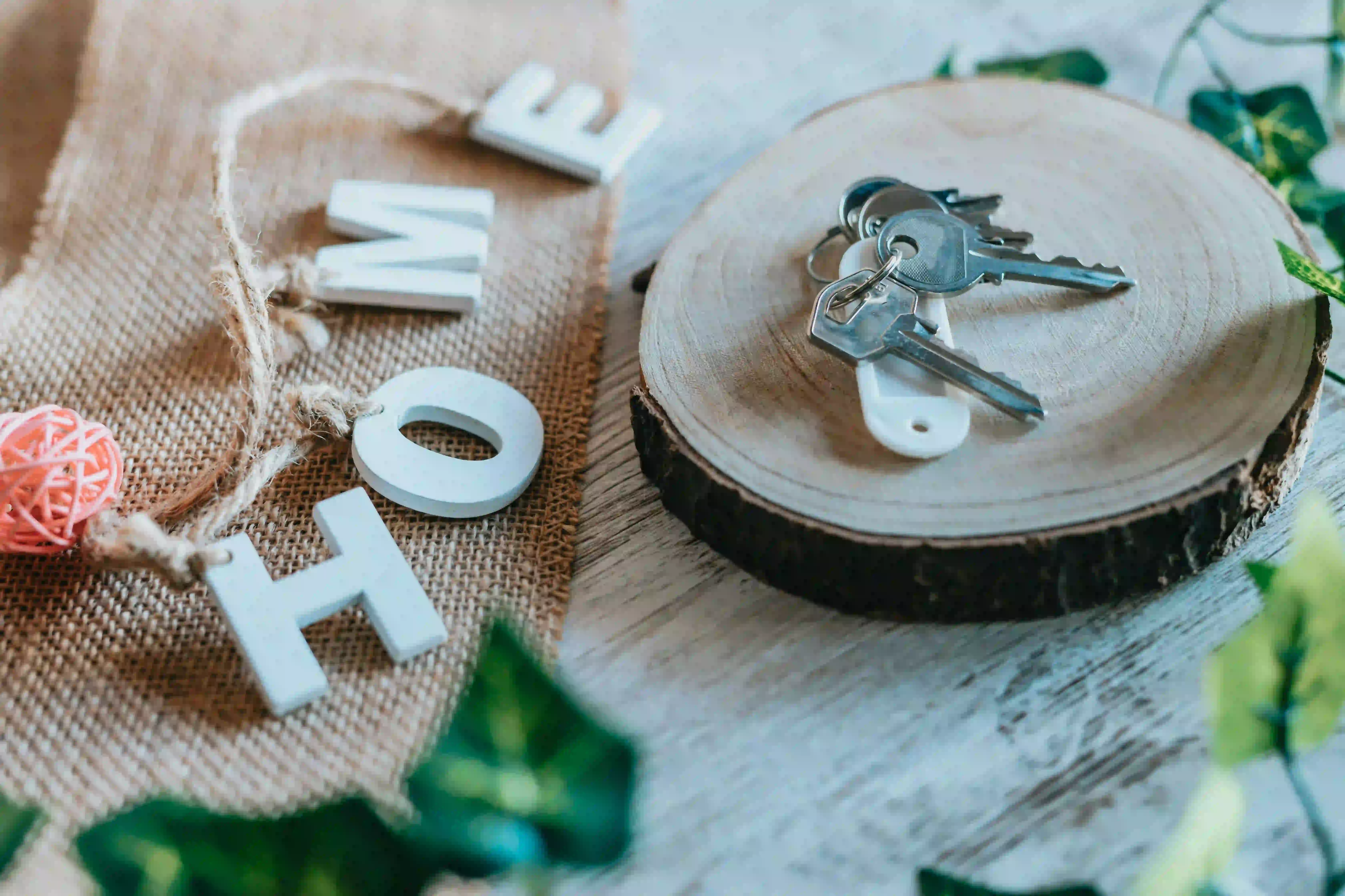 Home keys and decor showcasing real estate agent listing content ideas for sellers.