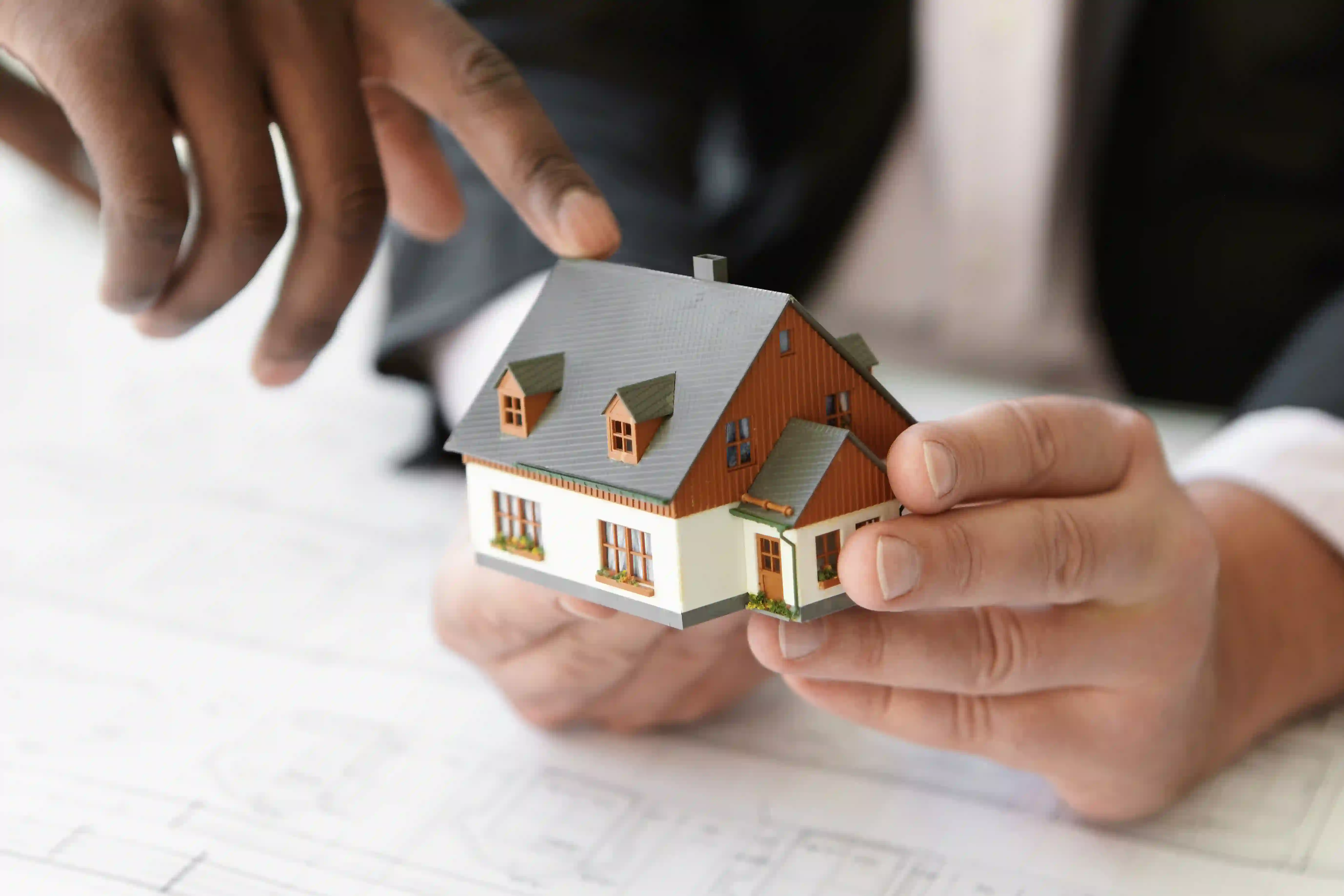 Real estate agent brand video for website homepage featuring home model.